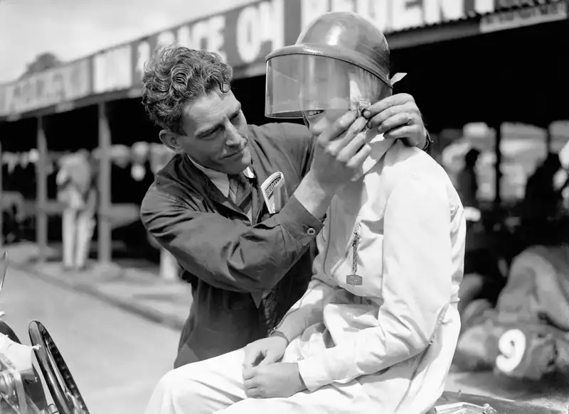 A-Brooklands-mechanic-fastens-the-buckle-on-Miss-Dorothy-Turners-helmet-1937-1480x1081.thumb.webp.f53356d680012f5b8bedf4e1da62580b.webp